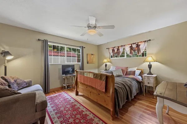 a bed room with bed and a window