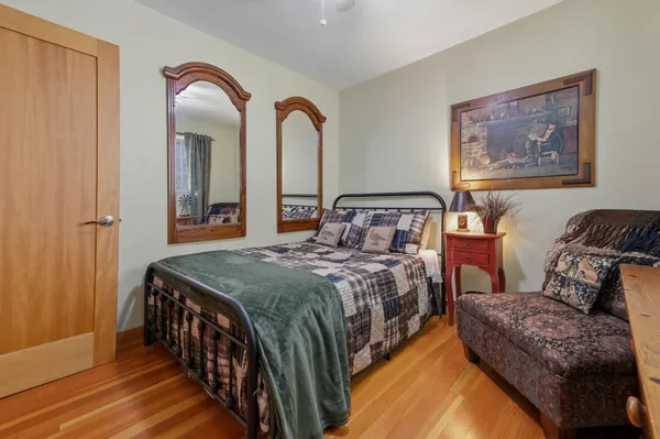 a bed room with furniture and a window