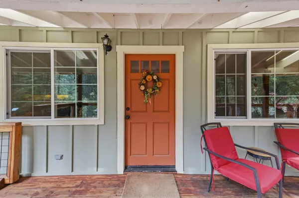 a view of a balcony with wooden floor