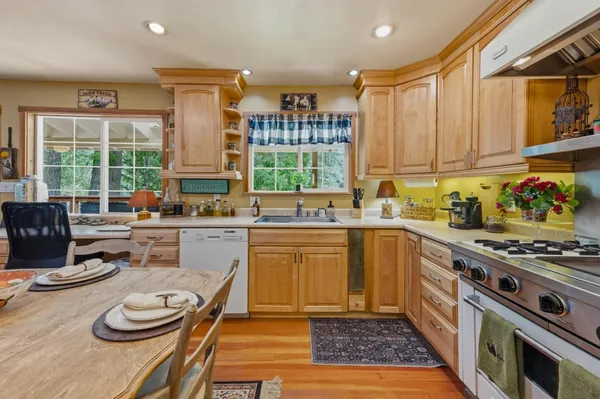 a kitchen with a sink stove and cabinets