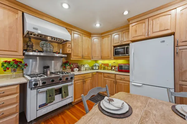 a kitchen with a stove and a refrigerator