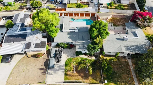 an aerial view of a house with a swimming pool