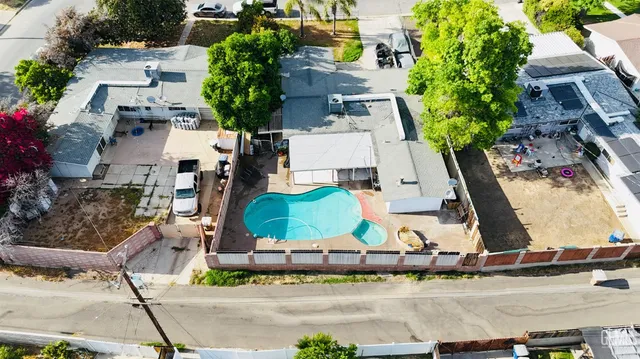 an aerial view of a large building with outdoor space