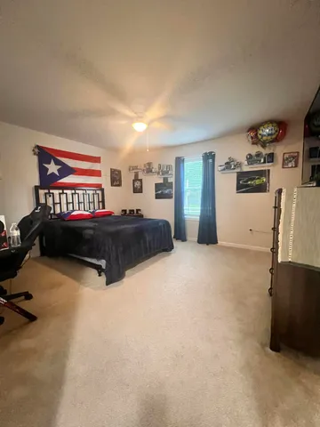 a bedroom with furniture and window