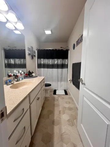 a large white kitchen with a large window