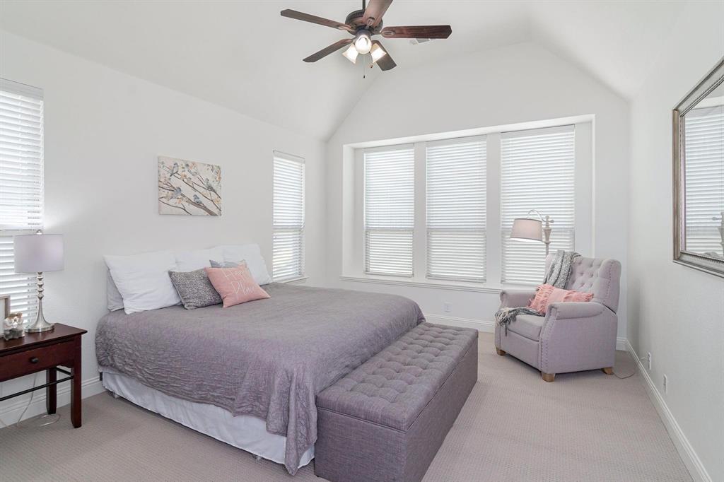 4210 Magnolia Road Melissa, TX 75454 - Photo 13 of 22 Vaulted ceiling with a ceiling fan, multiple windows with blinds, and light-toned carpeting