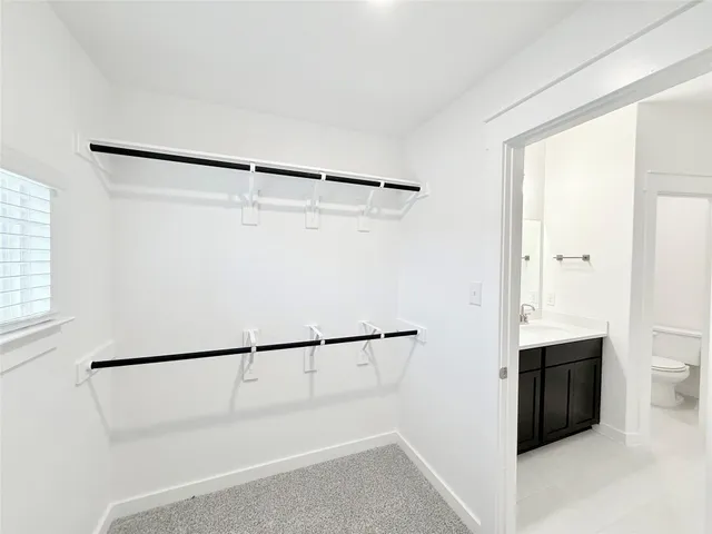a metallic refrigerator freezer sitting in a kitchen