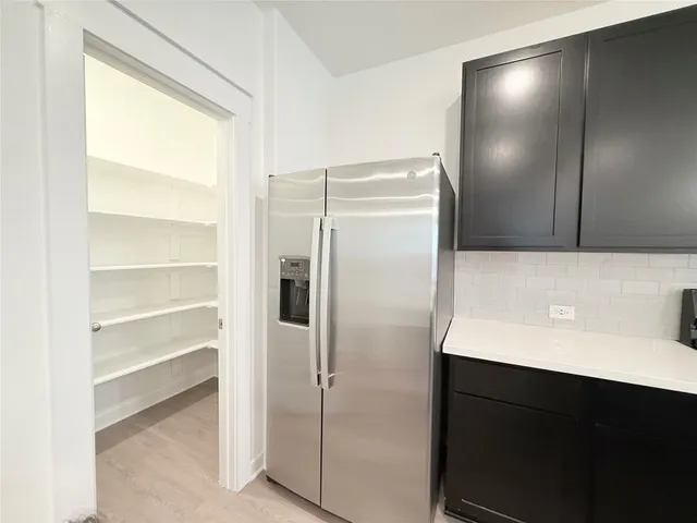 a white toilet sitting next to a white sink
