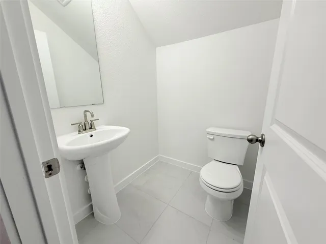 a picture of a bathroom with a shower