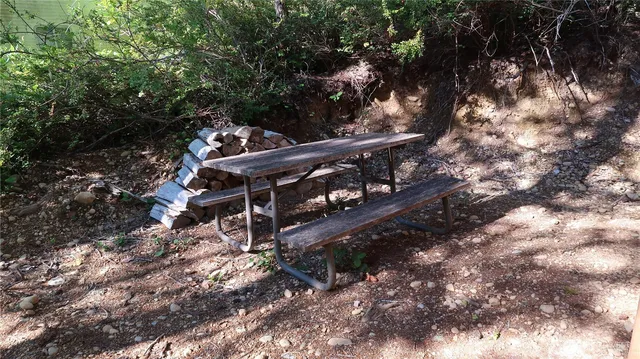 a view of a room with window and wooden walls