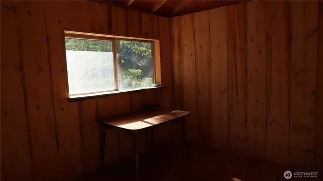 a view of a bathroom with shower and a bathtub