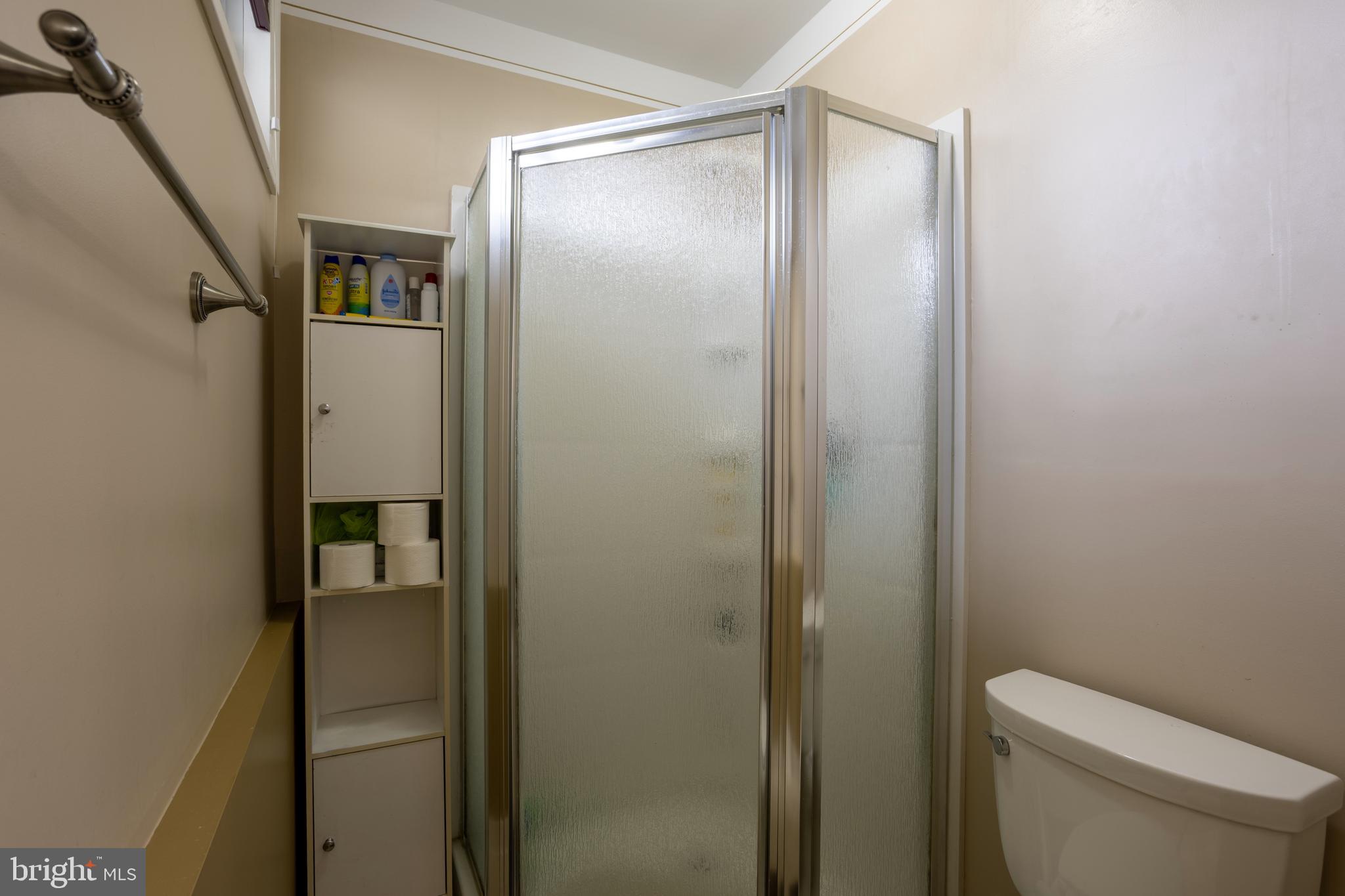 3215 Northbrook Road Baltimore, MD 21208 - Photo 37 of 50 a bathroom with a shower and a toilet