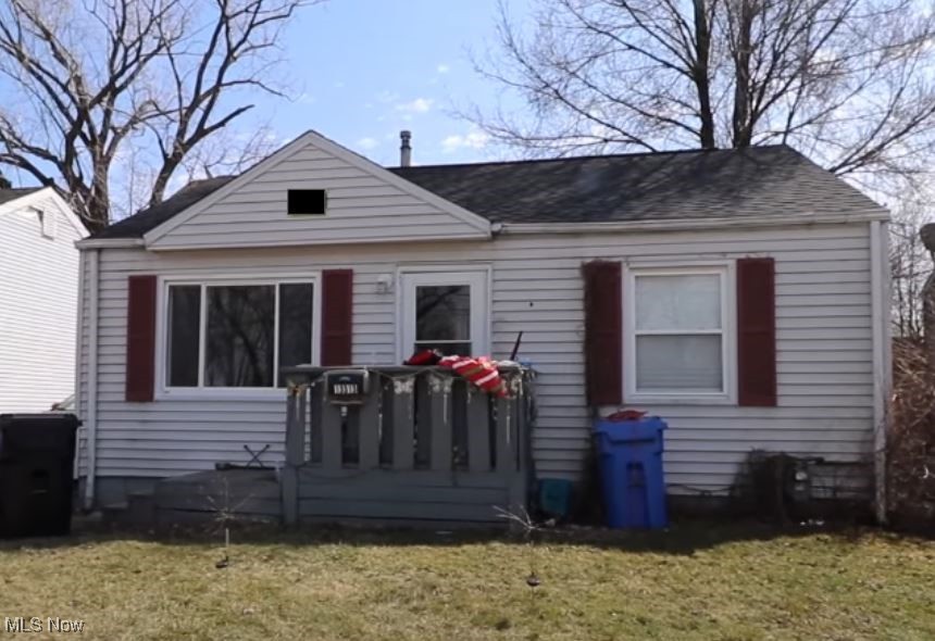 13313 Thornhope Road Cleveland, OH 44135 - Photo 1 of 1 Back of property with a shingled roof and a yard