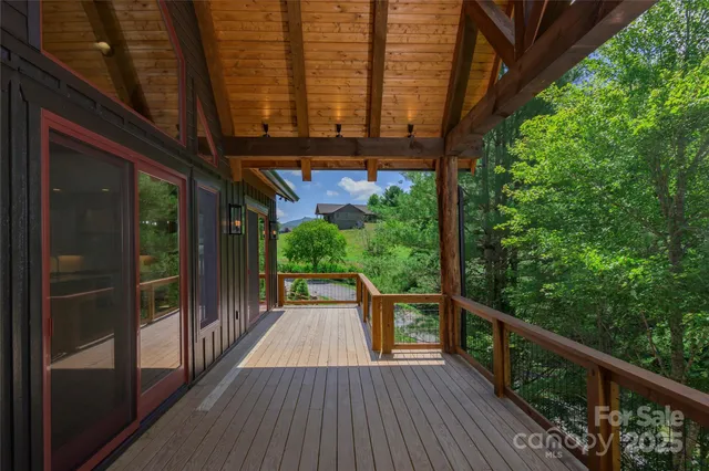 a view of a balcony with wooden floor