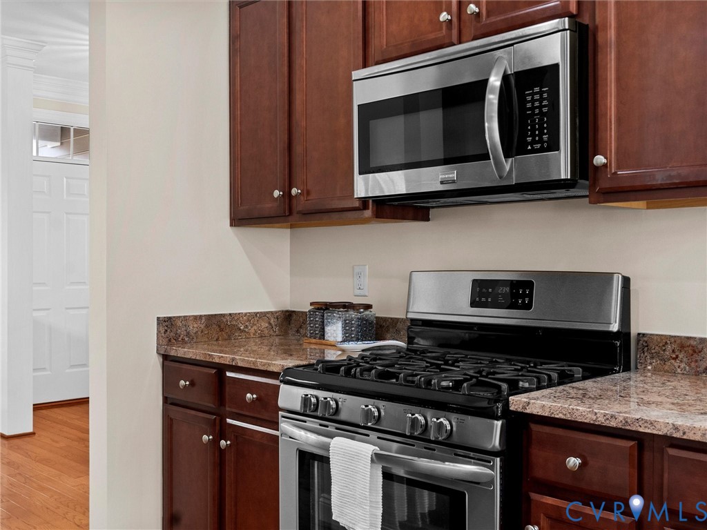 1555 Rocky Ford Road Powhatan, VA 23139 - Photo 22 of 80 a kitchen with stainless steel appliances granite countertop a stove and a microwave
