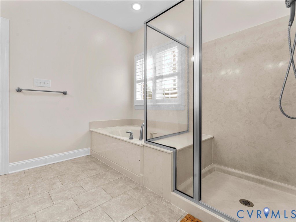 1555 Rocky Ford Road Powhatan, VA 23139 - Photo 34 of 80 a spacious bathroom with a bathtub and a shower