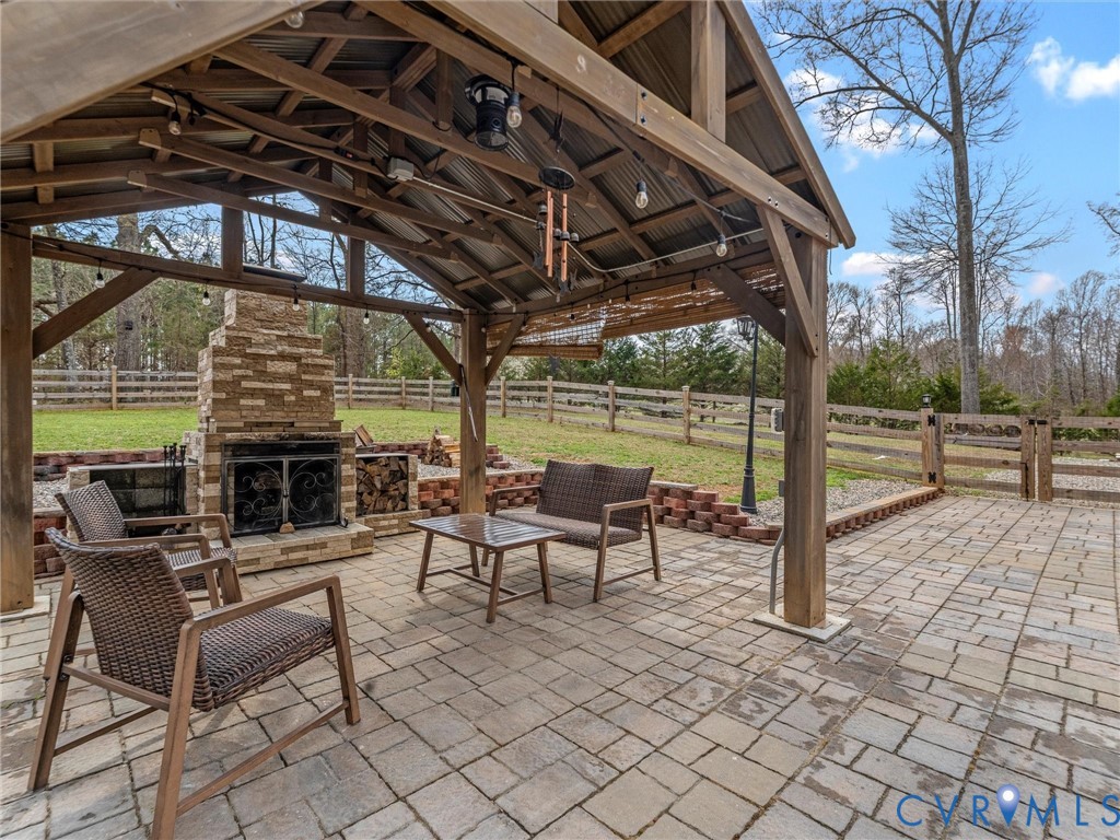 1555 Rocky Ford Road Powhatan, VA 23139 - Photo 65 of 80 a view of a porch with furniture and a grill