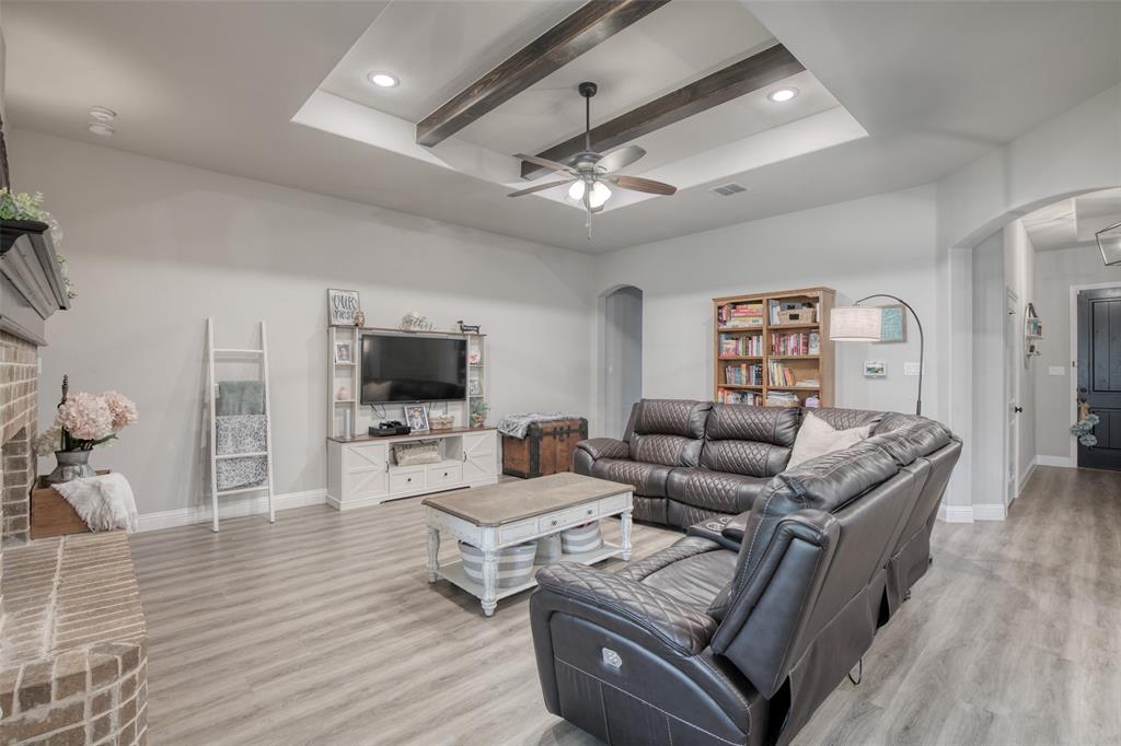 211 Rees Avenue Godley, TX 76044 - Photo 1 of 18 a living room with furniture and a flat screen tv