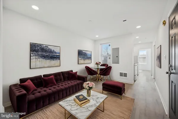 a living room with furniture and a rug