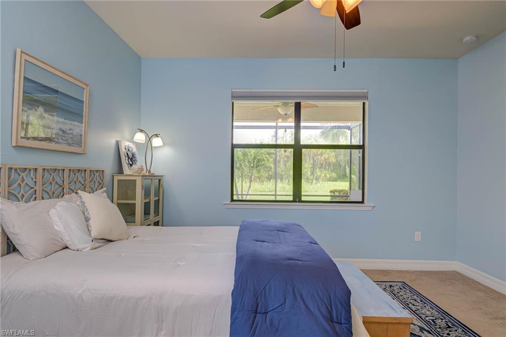 5761 Mayflower Way Ave Maria, FL 34142 - Photo 15 of 39 a bedroom with a bed and a window