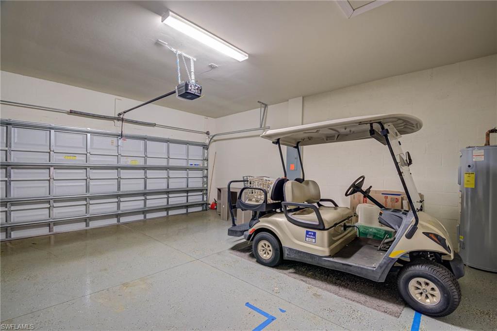 5761 Mayflower Way Ave Maria, FL 34142 - Photo 26 of 39 a view of a car garage