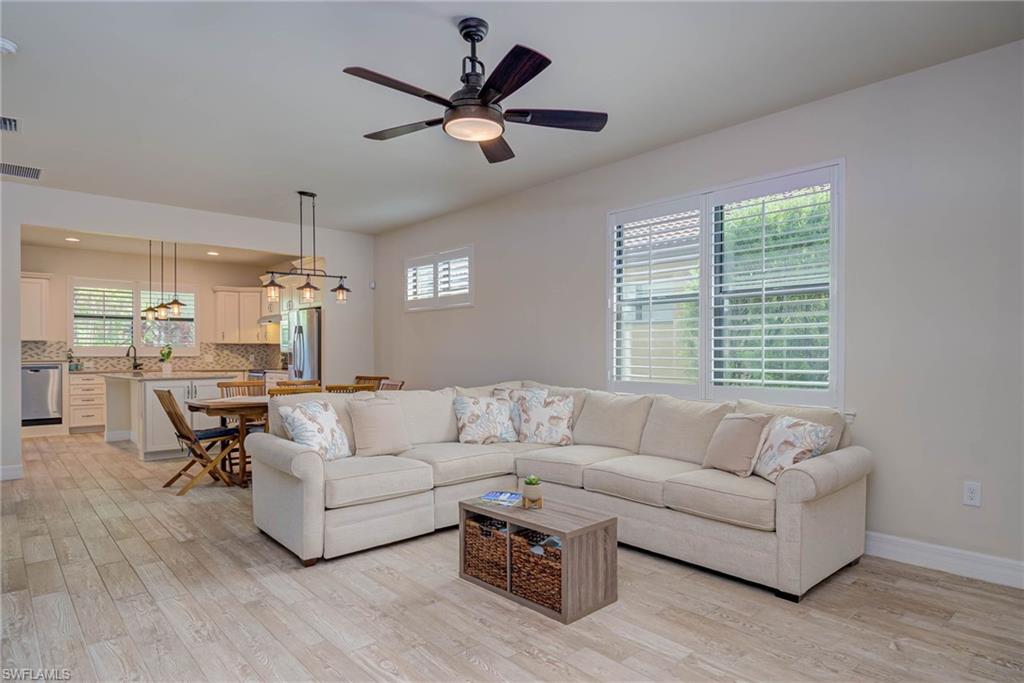 5761 Mayflower Way Ave Maria, FL 34142 - Photo 3 of 39 a living room with furniture and a large window