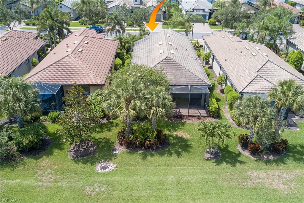 5761 Mayflower Way Ave Maria, FL 34142 - Photo 32 of 39 an aerial view of house with yard and outdoor seating