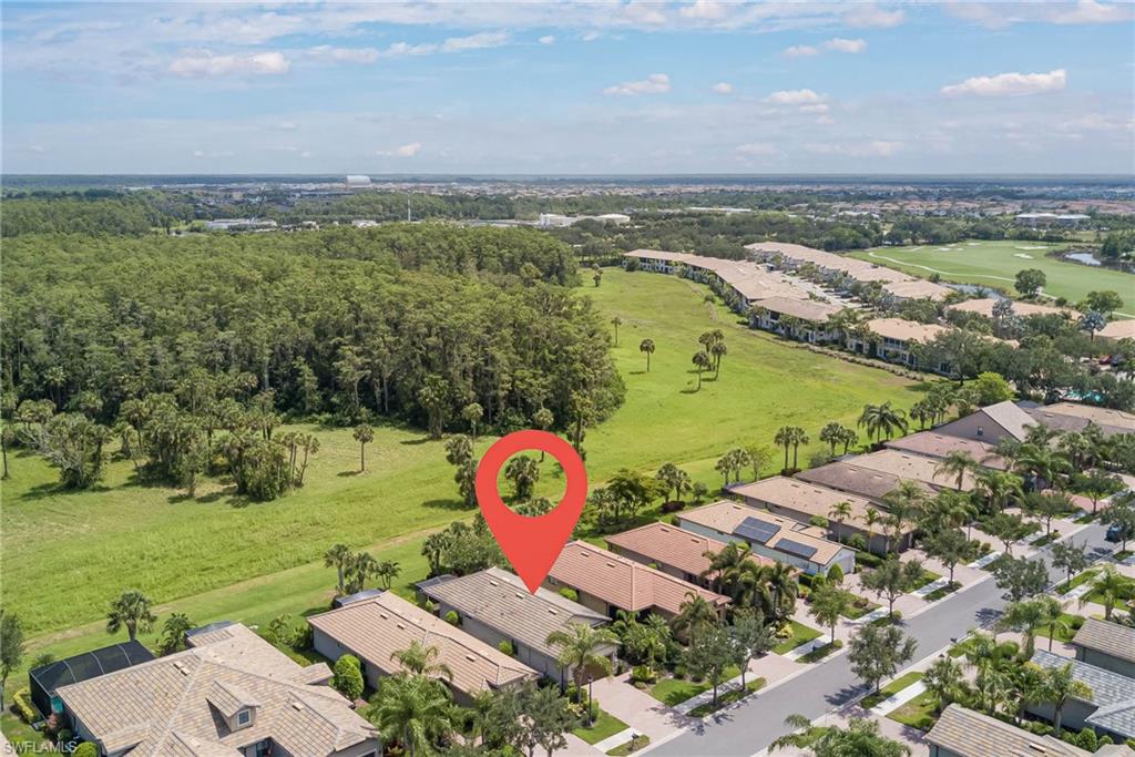 5761 Mayflower Way Ave Maria, FL 34142 - Photo 36 of 39 an aerial view of a swimming pool with a yard