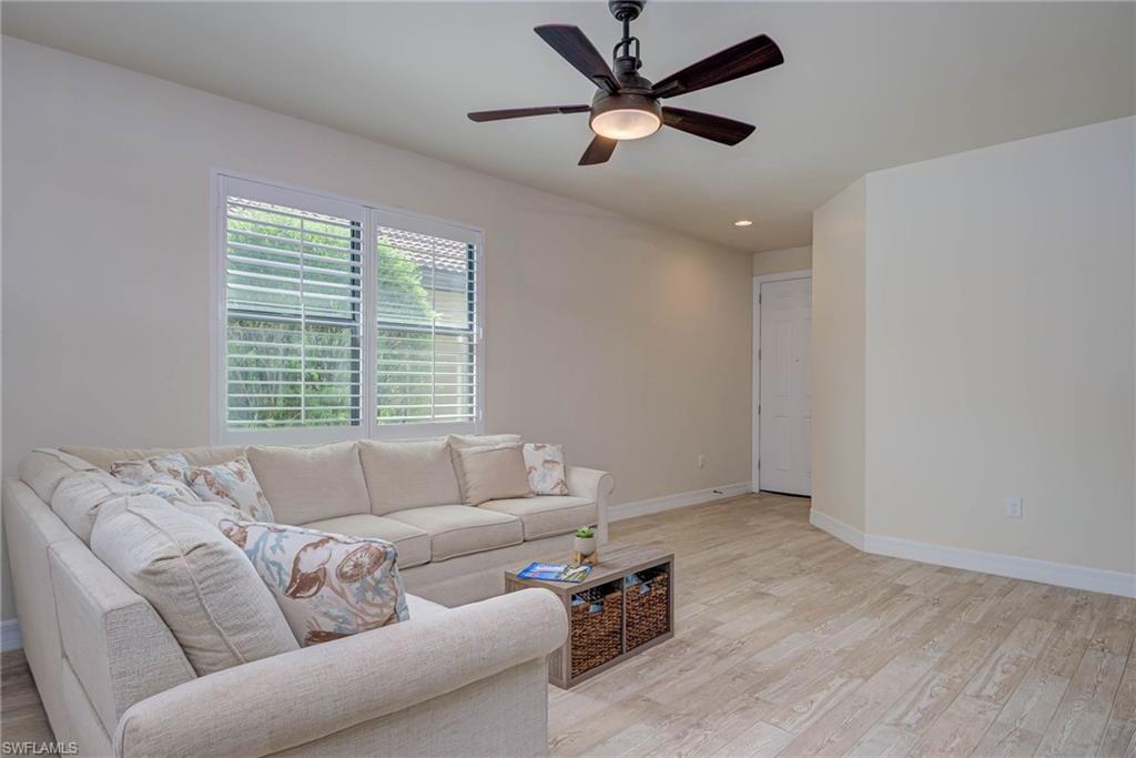 5761 Mayflower Way Ave Maria, FL 34142 - Photo 5 of 39 a living room with furniture and a window