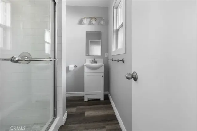 a view of a bathroom from a hallway