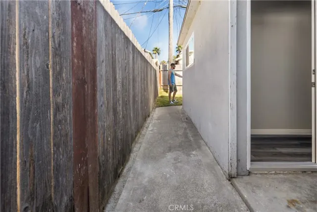 a view of a pathway gate with wooden walls