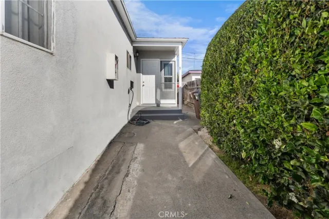 a view of a pathway besides a house