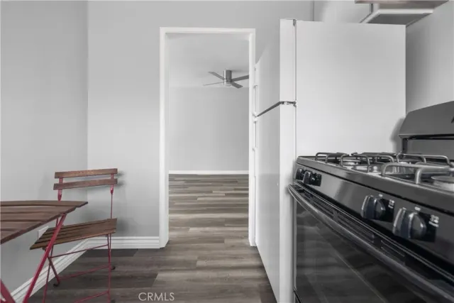 a kitchen with a stove and a refrigerator