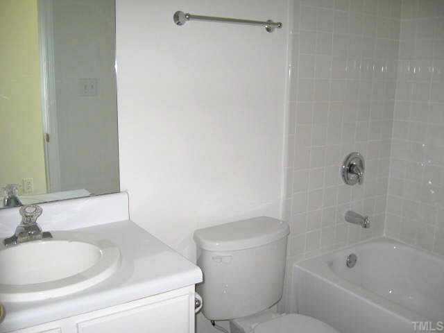 2305 Springhill Avenue Raleigh, NC 27603 - Photo 9 of 10 a bathroom with a toilet and a sink