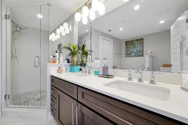 a bathroom with a sink double vanity and a mirror