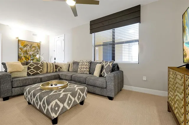 a spacious bedroom with a bed and a couch