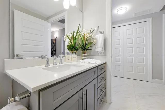 a bathroom with a sink and a mirror
