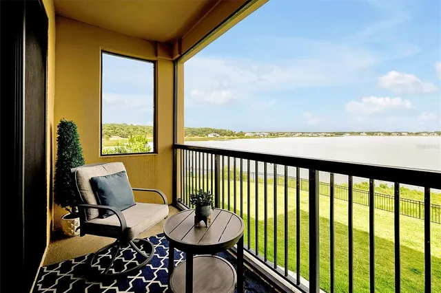 a view of a balcony with chairs