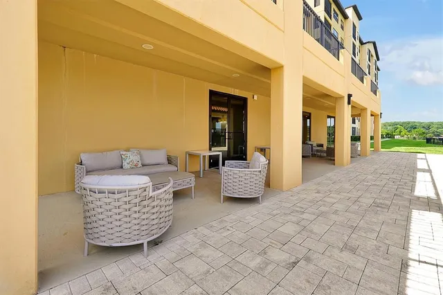 a living room with couch chairs and a fireplace