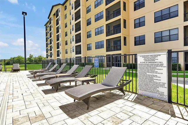 a view of a patio with a table and chairs