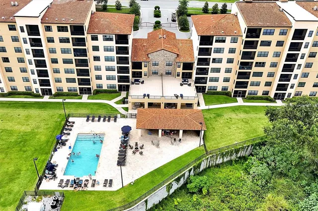 a aerial view of a large building with a yard