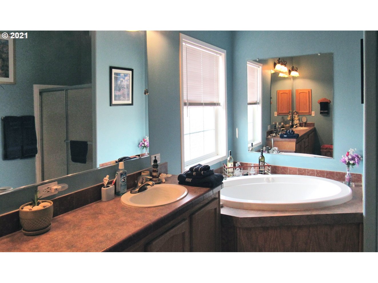 480 Roe Road Winlock, WA 98596 - Photo 13 of 24 a bathroom with a sink double vanity and a mirror