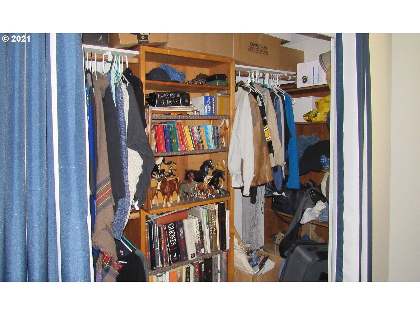 480 Roe Road Winlock, WA 98596 - Photo 15 of 24 a view of walk in closet with clothes and shoes