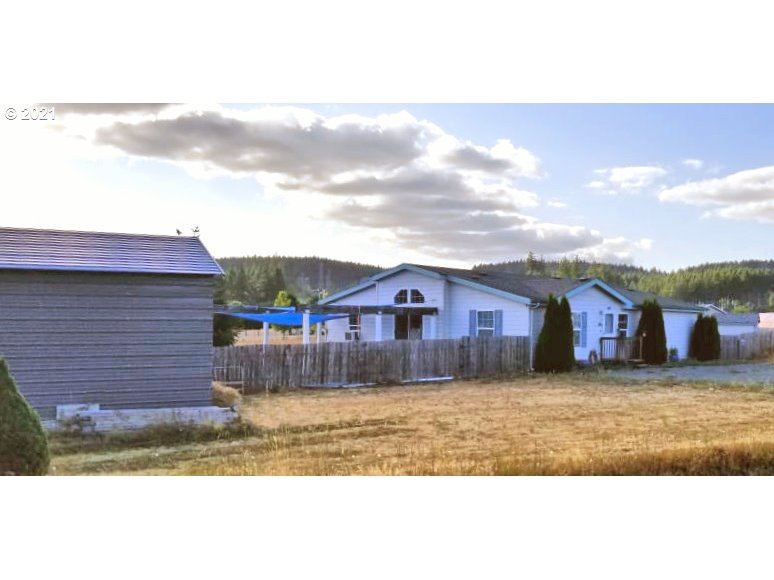 480 Roe Road Winlock, WA 98596 - Photo 24 of 24 a view of a yard in front of a house