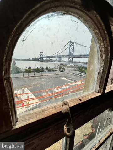 a view of a studio with wooden floor