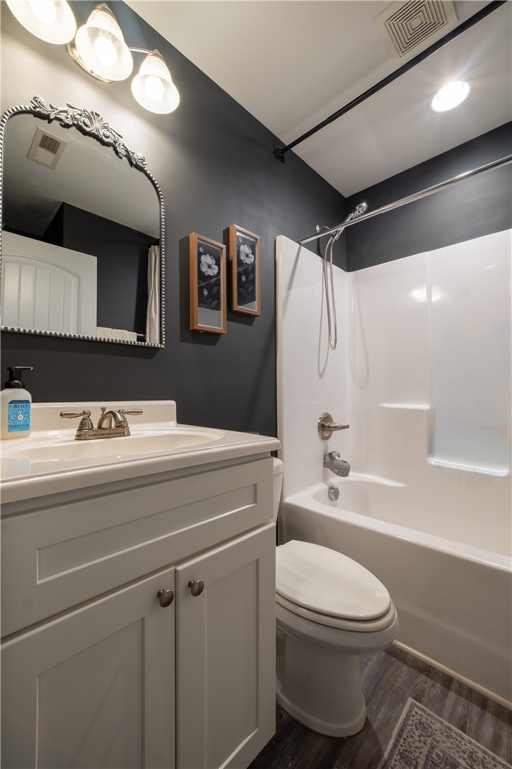 400 Green View Court Westminster, SC 29693 - Photo 12 of 33 This sleek bathroom features a modern vanity and a bright, functional shower-tub combination.