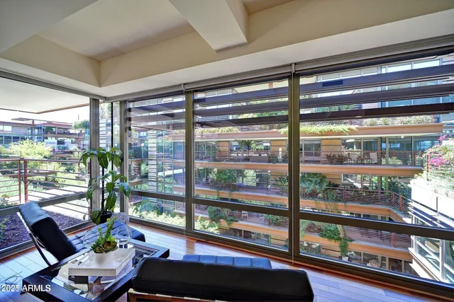 a room with furniture and a large window