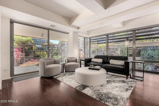a living room with furniture and a large window