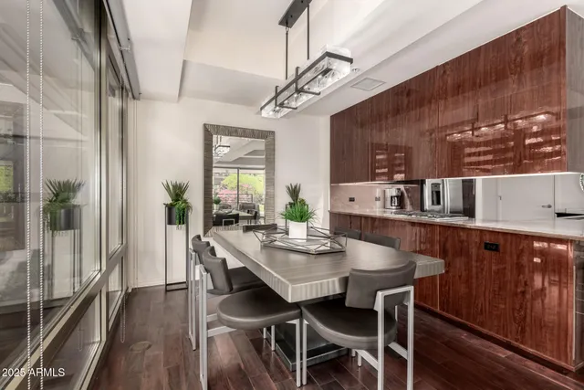 a dining room with furniture a rug and wooden floor