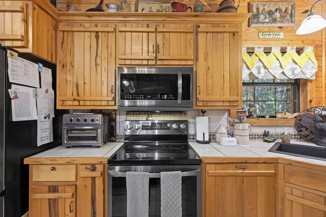 a kitchen with a stove and a sink